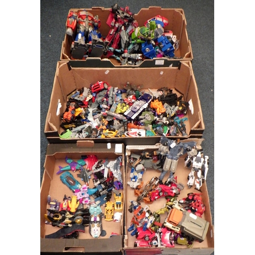 144 - A large qty of Transformer toys / figures (4)