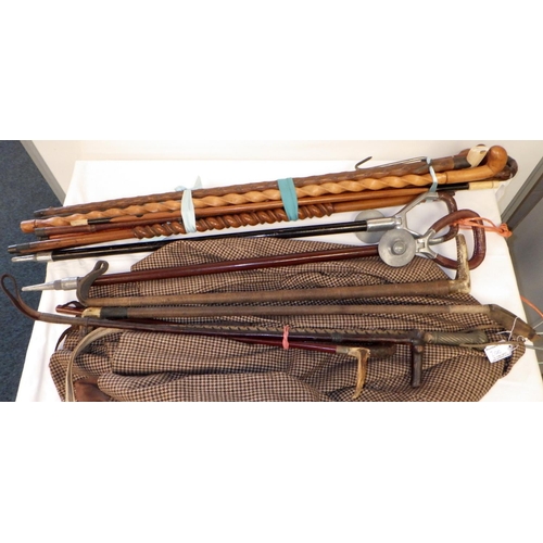 200 - A group of various sticks, whips together with a ladies riding jacket