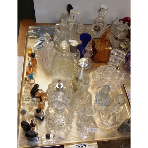 207 - Two trays of various glass perfume bottles, vase, paperweight, various miniature tea cups & saucers ... 