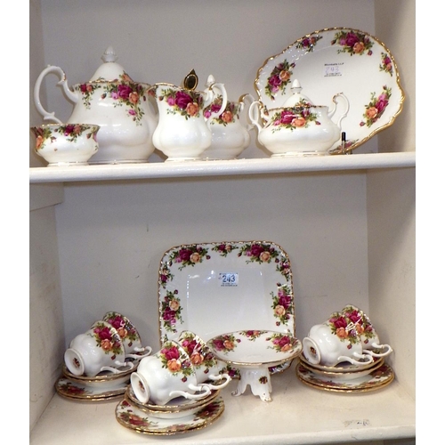 243 - A Royal Albert tea service consisting of 6 trios, tea pot, coffee pot, sugar bowl, jug, lidded jar, ... 