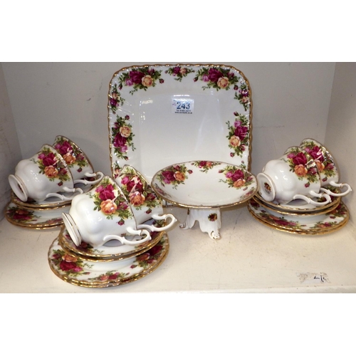 243 - A Royal Albert tea service consisting of 6 trios, tea pot, coffee pot, sugar bowl, jug, lidded jar, ... 