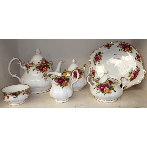 243 - A Royal Albert tea service consisting of 6 trios, tea pot, coffee pot, sugar bowl, jug, lidded jar, ... 