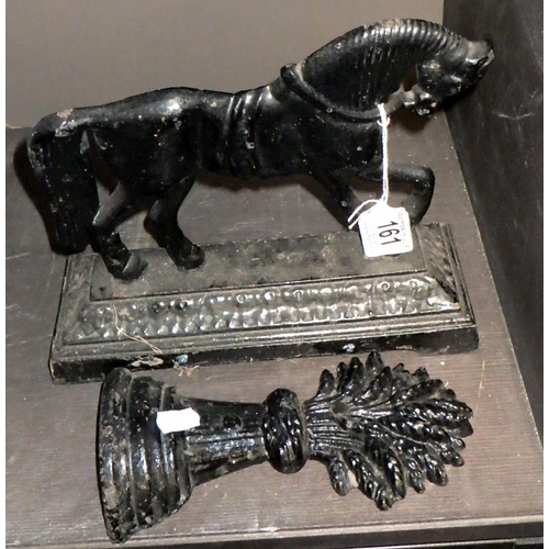 161 - A Cast iron horse door stop together with a Sheaf of corn stop (2)