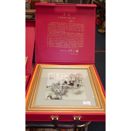 198 - Two Oriental framed and cased plaques 40cm x 40cm (2)