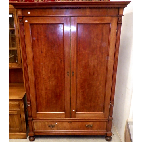 941 - A late 19th cen mahogany wardrobe with double doors and lower drawer, dismantles, missing moulding f... 