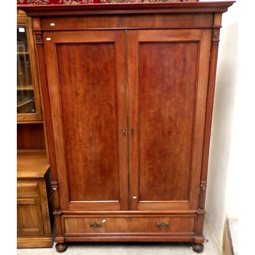 941 - A late 19th cen mahogany wardrobe with double doors and lower drawer, dismantles, missing moulding f... 