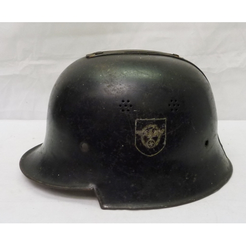 407 - A German WWII style steel helmet shell with non-pattern liner; a German WWII style police / fire hel... 