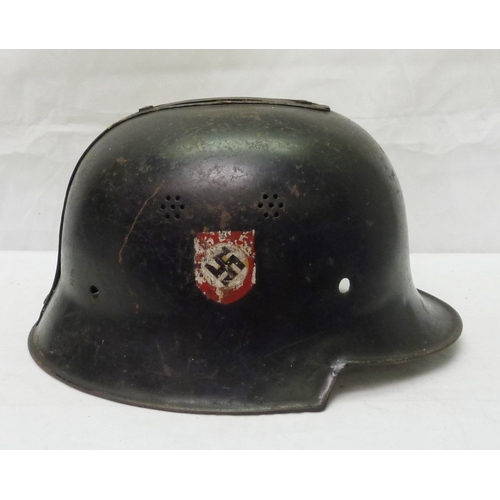 407 - A German WWII style steel helmet shell with non-pattern liner; a German WWII style police / fire hel... 