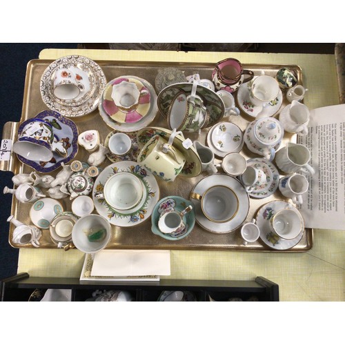 207 - Two trays of various glass perfume bottles, vase, paperweight, various miniature tea cups & saucers ... 