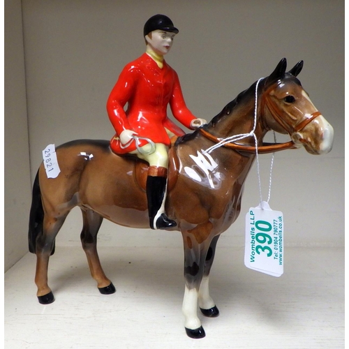 390 - A Beswick horse and huntsman