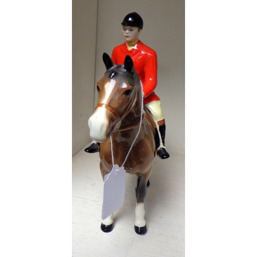 390 - A Beswick horse and huntsman