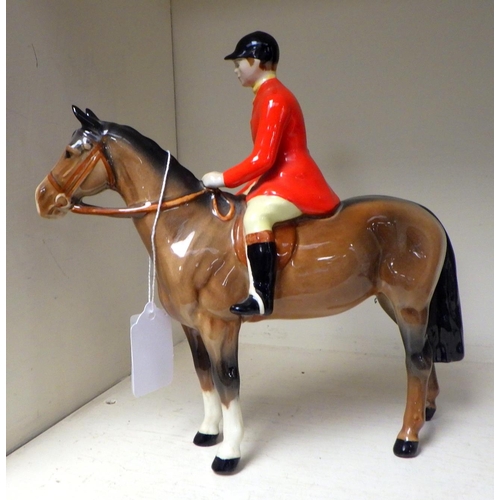 390 - A Beswick horse and huntsman