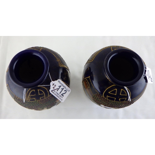 112 - A pair of Oriental vases 22cm tall