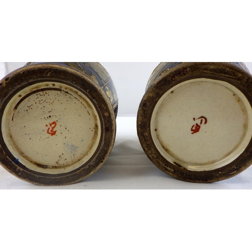 112 - A pair of Oriental vases 22cm tall