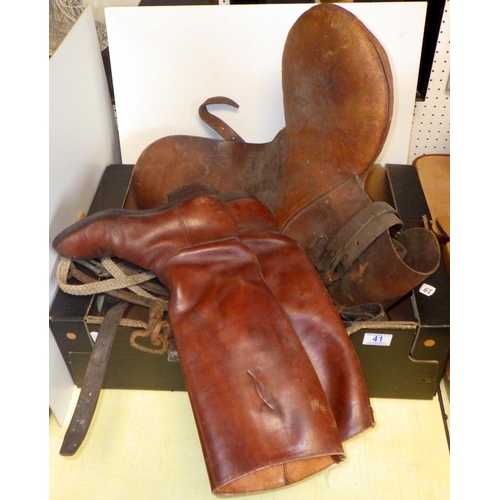 41 - A pair of brown leather boots together with a saddle and misc tack