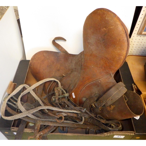 41 - A pair of brown leather boots together with a saddle and misc tack