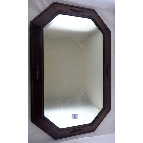 50 - An oak framed bevelled mirror together with three large prints (4)