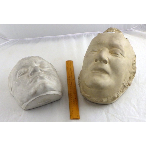 100 - Two plaster death masks depicting composers Beethoven and Wagner.