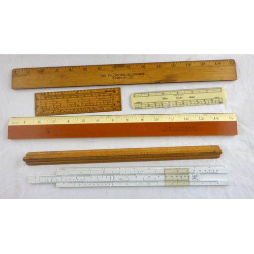 115 - A collection of approximately 50 wooden rulers.