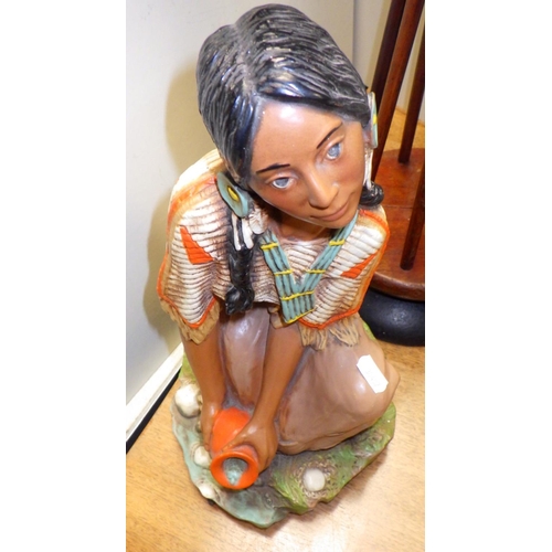 184 - A heavy cast based spinning stand together with a Resin figure of A Native American girl (2)