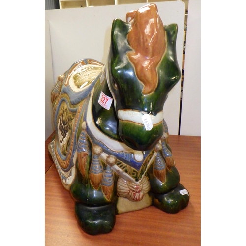 227 - An Oriental ceramic horse