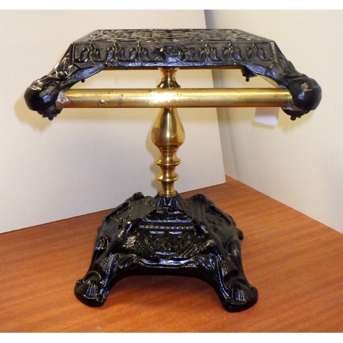 228 - A cast iron and brass pedestal trivet