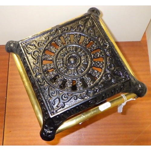 228 - A cast iron and brass pedestal trivet