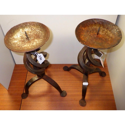 230 - A pair of wrought iron candlesticks