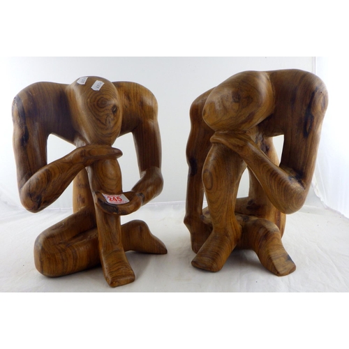 245 - Two carved hardwood figures