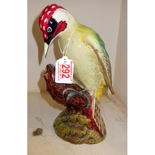 292 - A group of four Beswick birds, pheasant 1225, Woodpecker 1228, owl & Ben Eagles Scotch decanter (sma... 