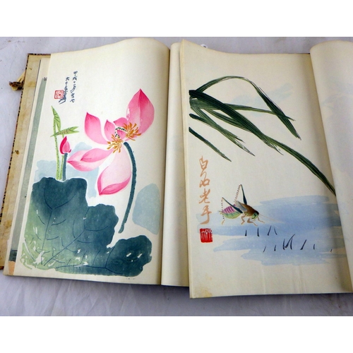 316 - A pair of Japanese woodblock print books, soft bound in blue papers and contained in a cloth bound h... 