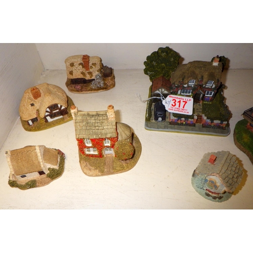 317 - A group of various cottages etc to include Danbury Mint, Lilliput lane etc