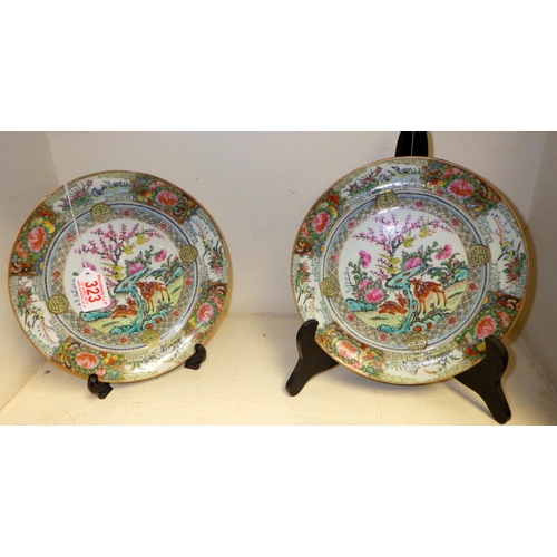 323 - A Pair of Chinese Famille Rose plates 21cm diameter af slight nibbles to edges