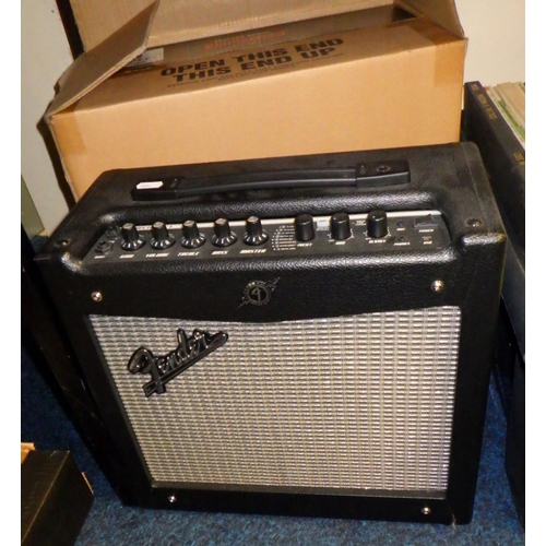 330 - A Hartwood electric guitar; a Fender portable amp.  Both boxed.