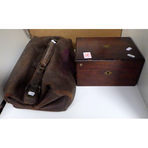 342 - A Gladstone bag; various documents and indentures on velum; photographs, ephemera; a Victorian box e... 