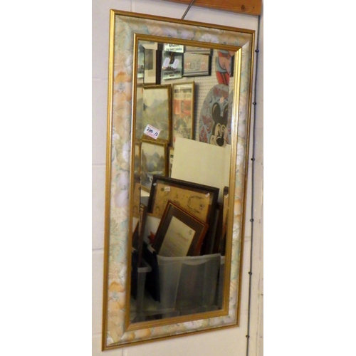 380 - A bevelled framed mirror together with a further mirror and a floral print (3)