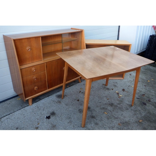 605 - A walnut dining table, low bookcase and a sideboard (3)