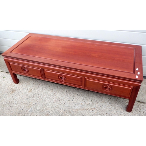 614 - An Oriental hardwood 3 drawer coffee table, 129cm long