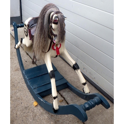 618 - A painted rocking horse, 153cm long, 92cm tall