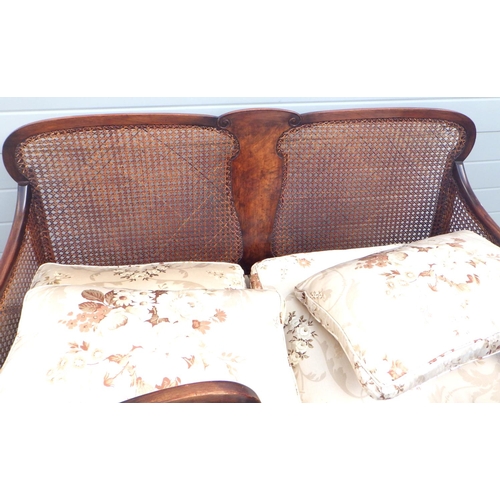 622 - A 1930's walnut bergere three piece suite, caning damaged, on cabriole legs