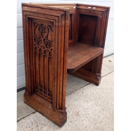 648 - A shortened panelled oak pew, 74cm wide, only one end is decorated