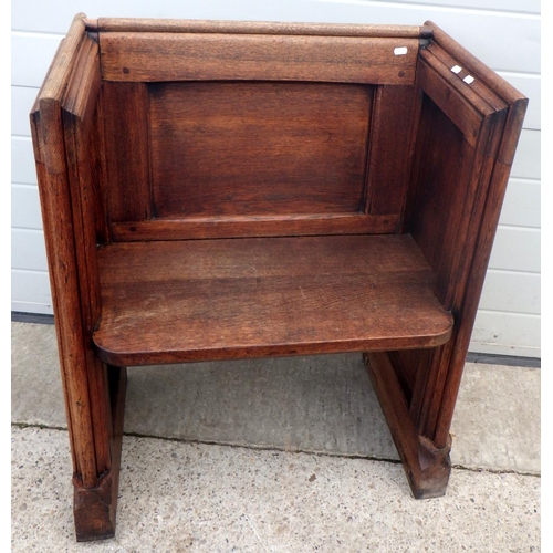 648 - A shortened panelled oak pew, 74cm wide, only one end is decorated