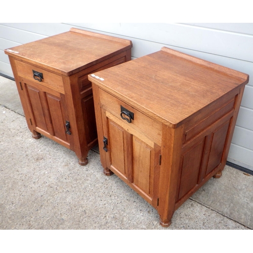 650 - A pair of adzed oak bedside cabinets, with carved fox motif, 51cm wide