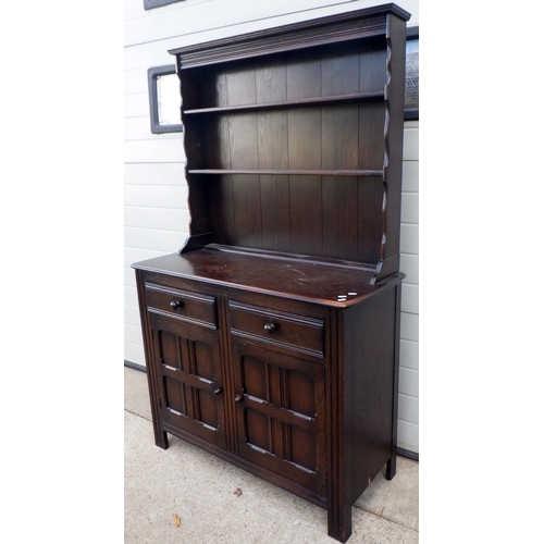 651 - A dark stained two drawer dresser with rack, 108cm wide