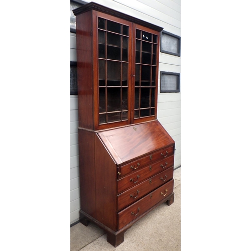 653 - A mahogany bureau bookcase, 110cm wide