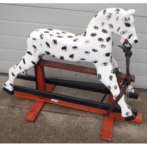 678 - A small painted rocking horse, 78cm tall