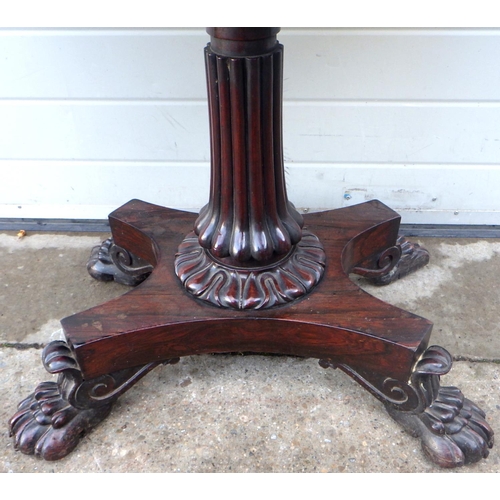 687 - A 19th cen rosewood foldover card table on paw feet, missing parts of feet, 92cm wide