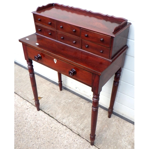 695 - A mahogany side table with upper drawers on turned legs, 68cm wide