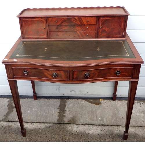 715 - A reproduction mahogany ladies writing table with green leather inset top, drawers stick, 92cm wide