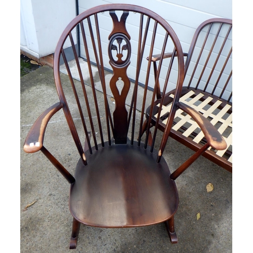 722 - A dark Ercol three seater settee frame together with a rocking chair frame (2)